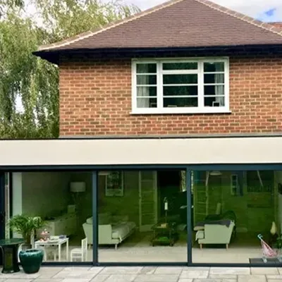 A brick building with a glass front door.